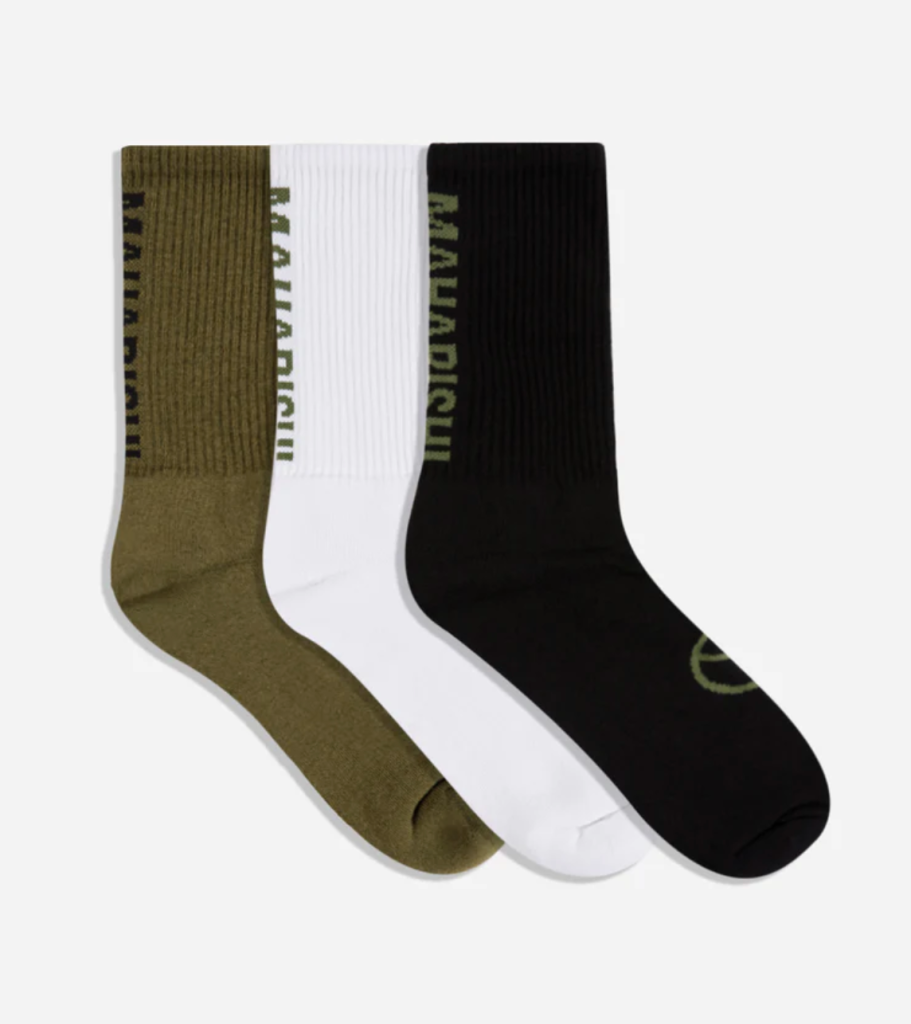 Green, white and blacks Marahishi crew socks on a white background