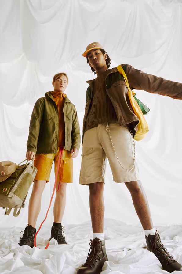 Two people together wearing brown Fjallraven clothing and gear