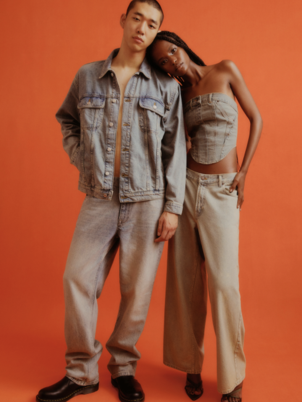 A couple wearing a Topman jean jacket and matching denim pants along with black loafers