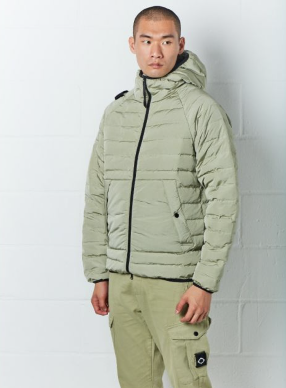 A man wearing a mint green MA.Strum technical jacket and matching pants