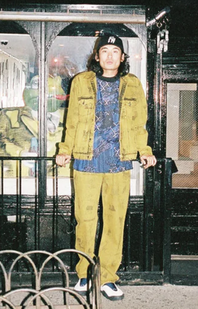 A man wearing a yellow fucking awesome jacket with matching pants