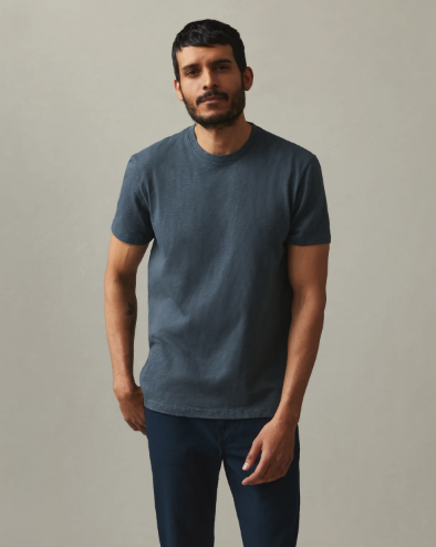 A man wearing a navy blue American Giant blank t-shirt