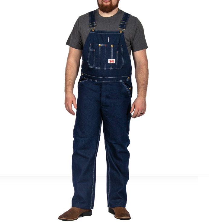 A man wearing class denim overalls from Round House