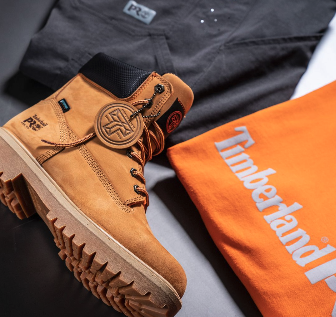 A close up of Timberland Pro boots, t-shirt and pants
