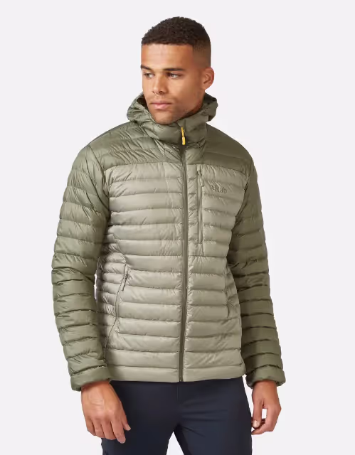 A man wearing an olive green puffy jacket by RAB