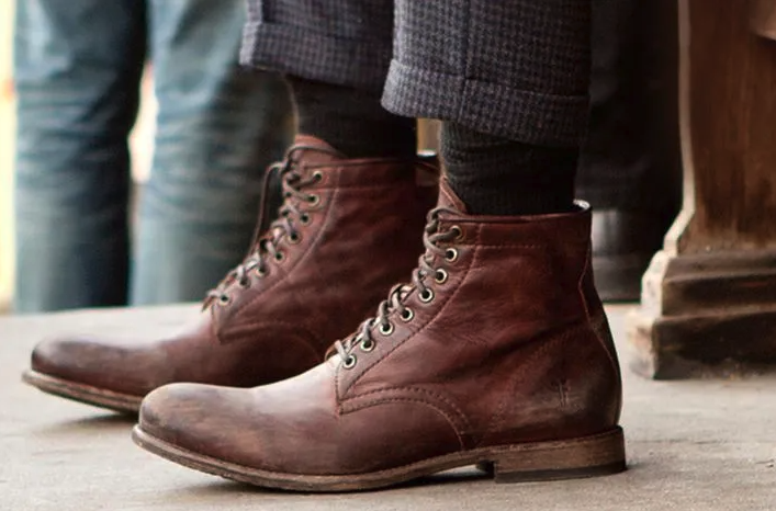 A man walking in a pair of brown Sorel boots