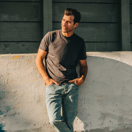 A man wearing a Taylor Stitch t-shirt with denim