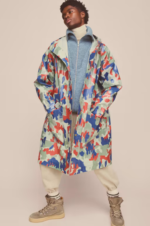 A man wearing colorful Isabel Marant jacket and cream pants