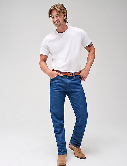 A man wearing a blank white t-shirt with blue Wrangler jeans