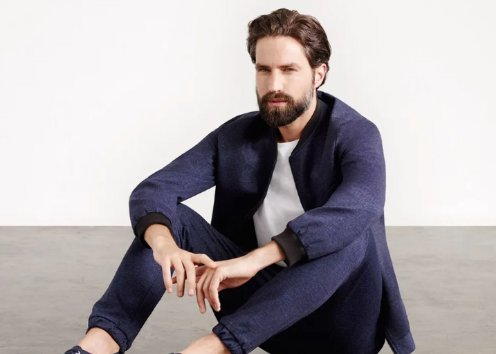 A man wearing a Superga casual suit with a white shirt underneath
