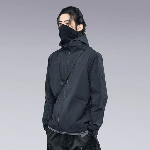 A man wearing a clotechnow black outfit featuring a black mask and technical jacket