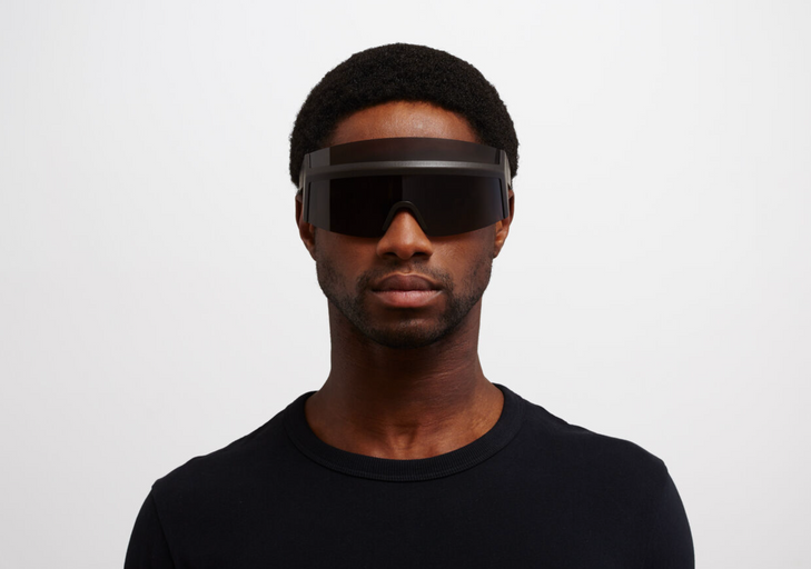 A man wearing oversize Mykita 'fast' sunglasses in all-black