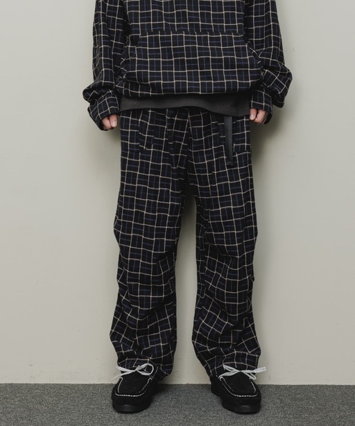 A man wearing a checkered baloriginal matching jacket and pants
