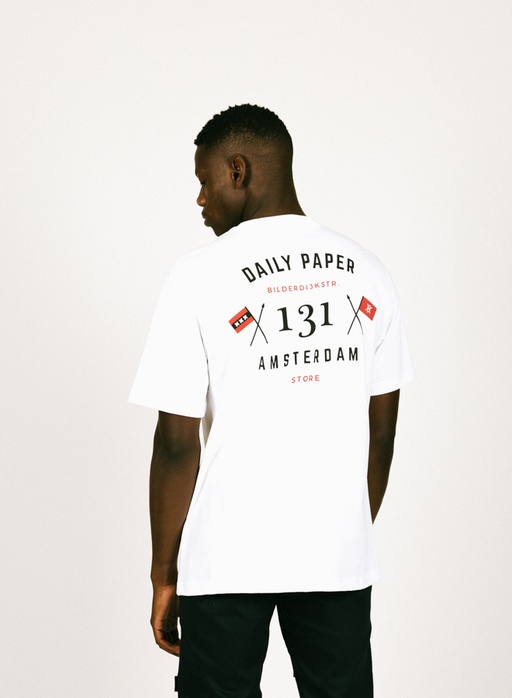 A man wearing a Daily Paper Amsterdam white t-shirt
