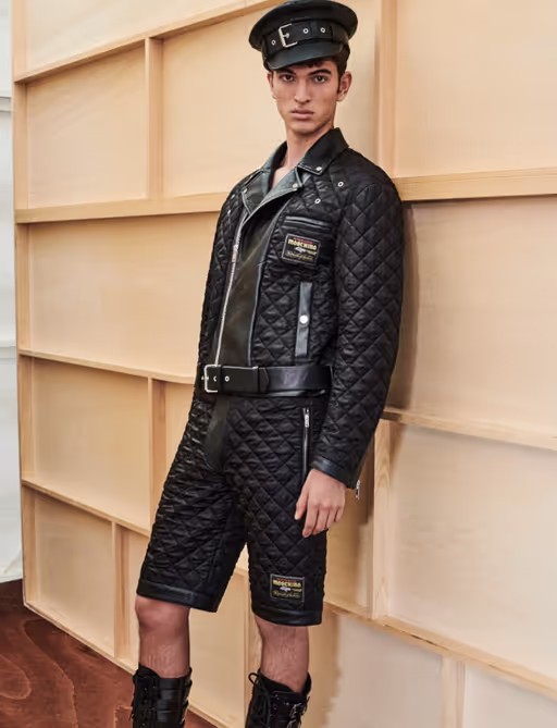 A man wearing a Moschino all black leather outfit