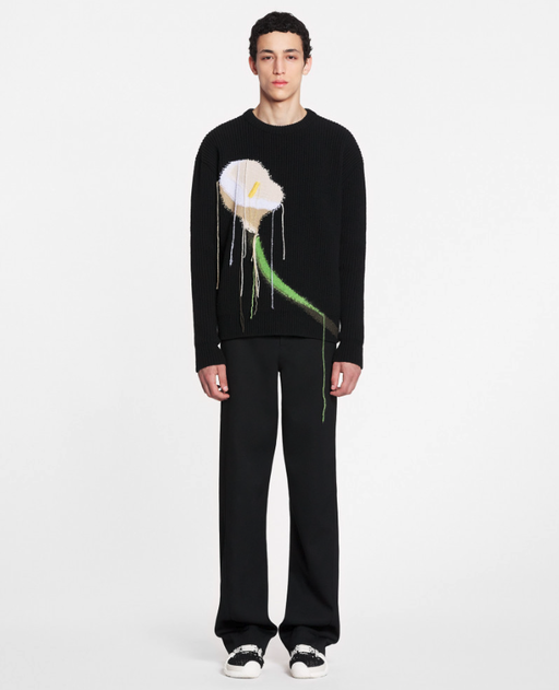 A man wearing a floral Lanvil black sweater and matching pants