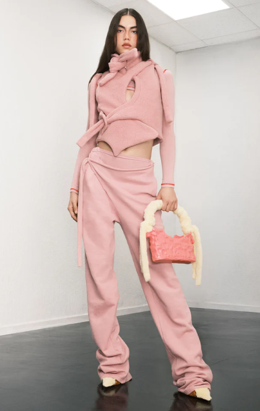 A woman wearing a pink OTTOLINGER outfit