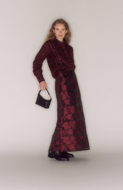 A woman wearing a GANNI outfit