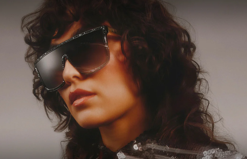 A woman wearing a pair of Quay Australia sunglasses