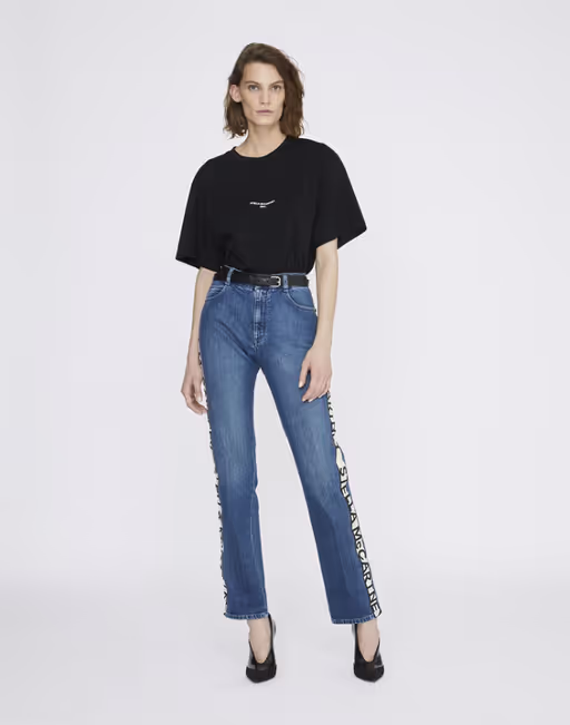 A woman wearing a Stella McCartney black boxy t-shirt