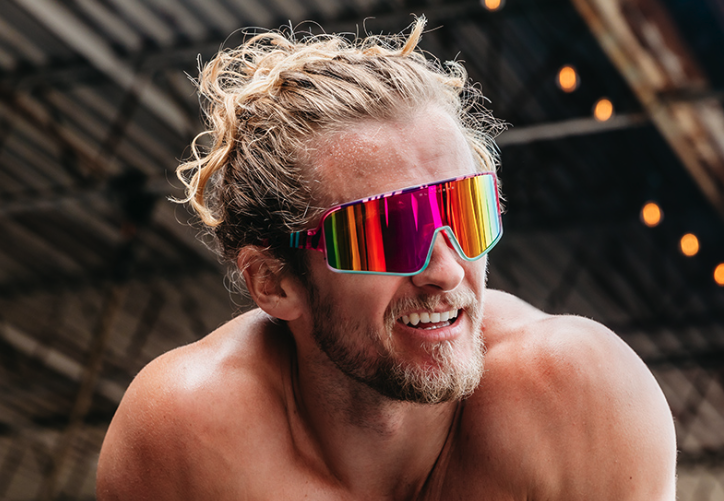A man wearing a colorful pair of Blenders sunglasses