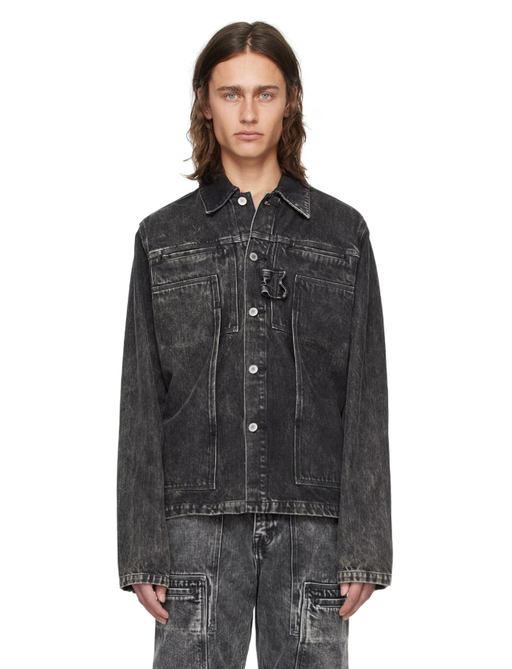 A man wearing a OUAT black cargo denim jacket