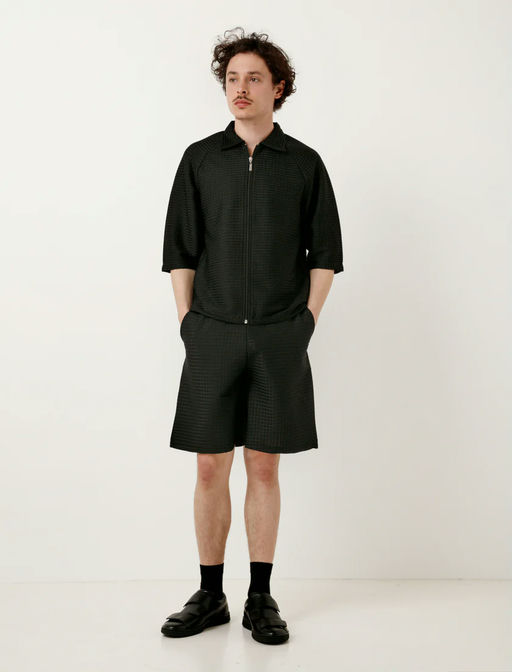 A man wearing a Cottweiler service shorts black