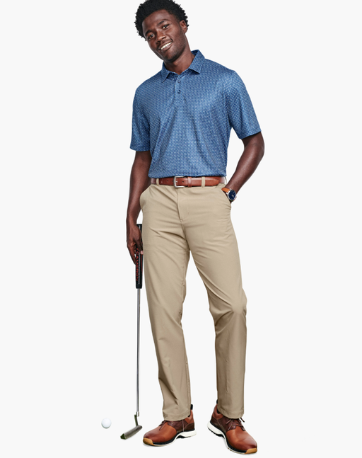 A man wearing a Johnston & Murphy navy geo xc4® performance polo