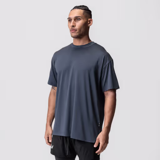 A man wearing asrv aerosilver® oversized tee - navy