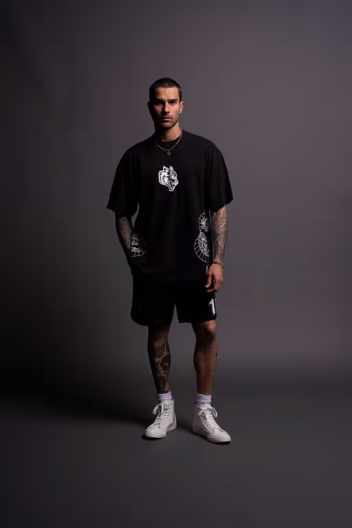 A man wearing Darc Sport perfect form "Premium" oversized tee in black