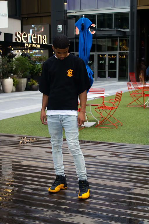A man wearing Bands Clothing black t-shirt