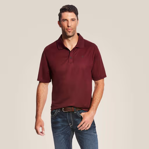 A man wearing Ariat maroon polo