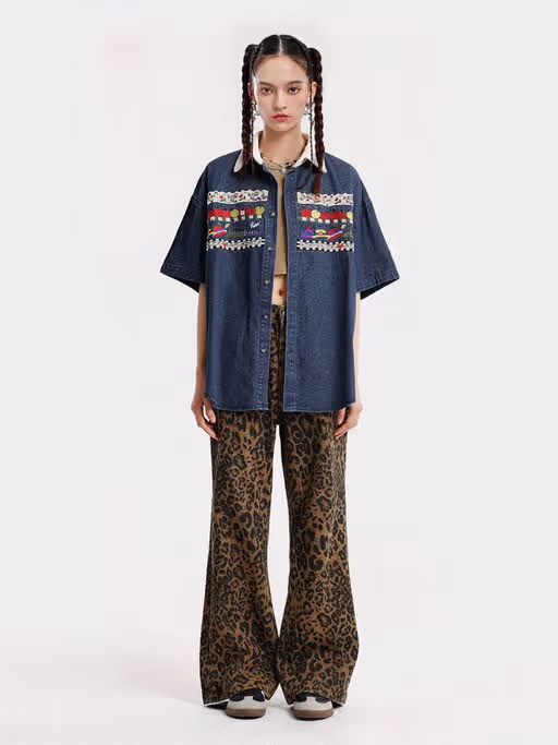A woman wearing Aelfric Eden denim short sleeve shirt