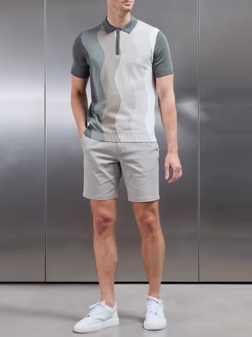 A man wearing arne wave knitted zip polo shirt - sage
