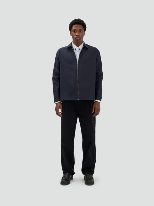 A man wearing Fairly Normal zipper overshirt black