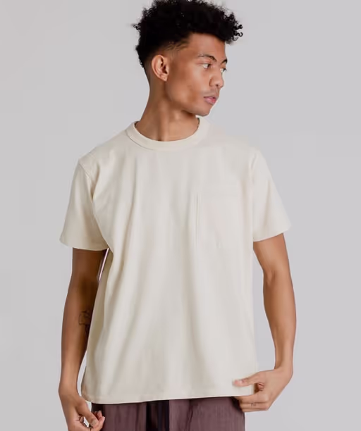 A man wearing Velva Sheen pigment dye shirt