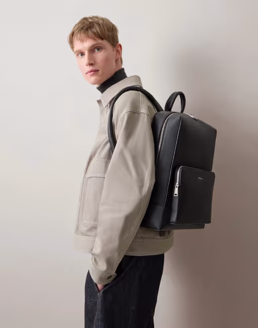A man carrying Mulberry farringdon backpack