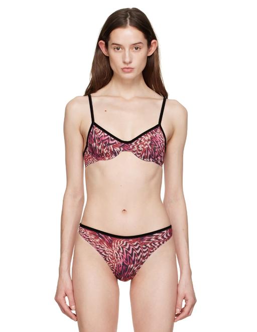 A woman wearing Fruity Booty pink sugar plum bra