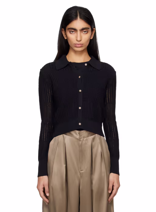A woman wearing FRAME black cropped cardigan