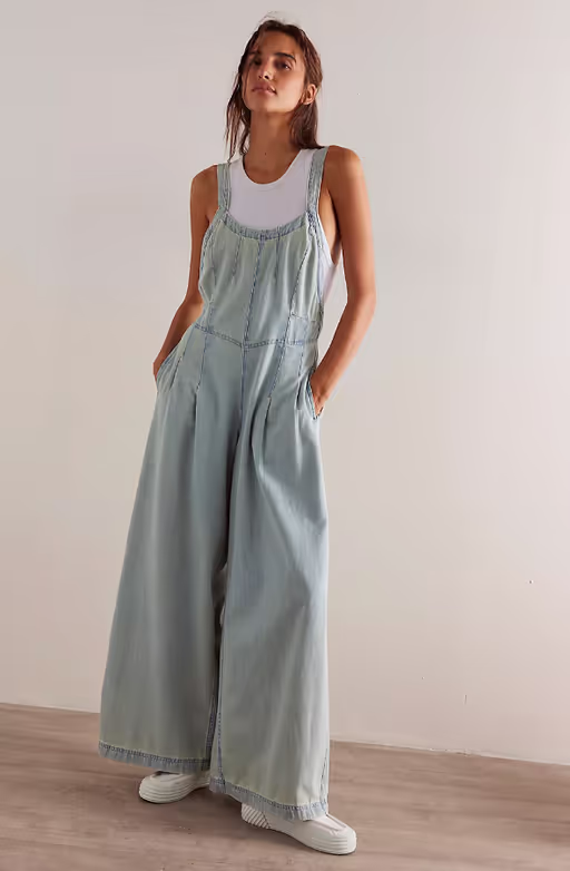 A woman wearing We the Free azurine blue lillith one-piece