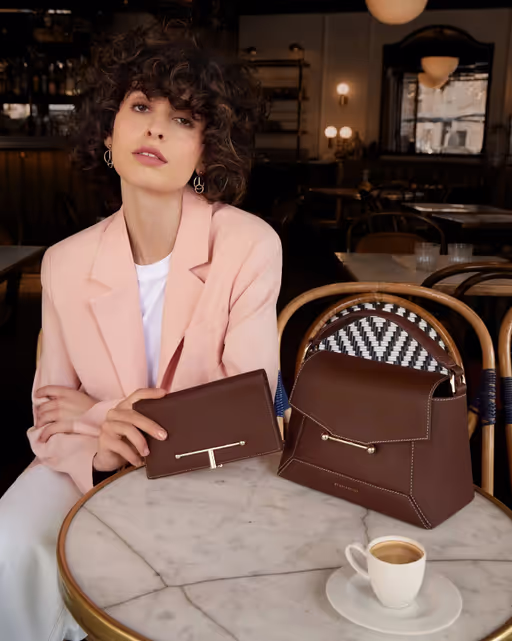 A woman with Strathberry mosaic bag