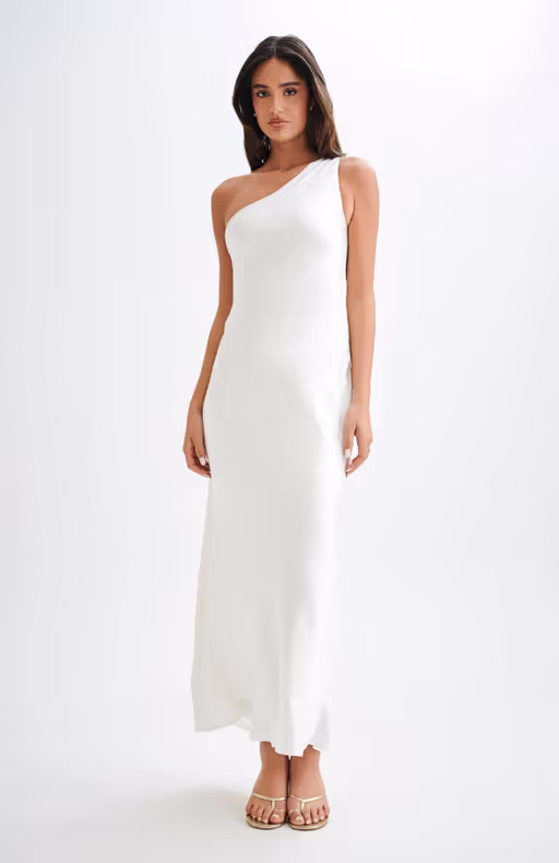 A woman wearing Meshki one shoulder satin maxi dress - white