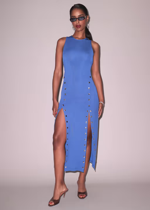 A woman wearing Fleur du Mal dusk blue undo me racer dress