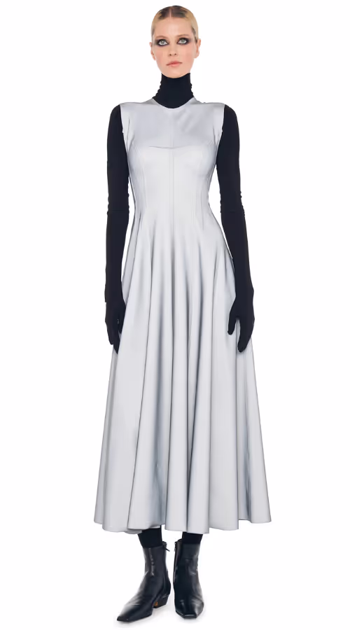 A woman wearing Norma Kamali grey sleeveless long grace dress