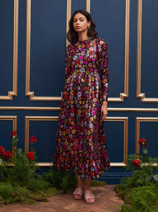 A woman wearing Sister Jane​ dream heir sequin midi dress