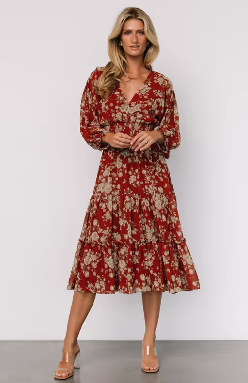 A woman wearing Baltic Born​ coventry tiered midi dress