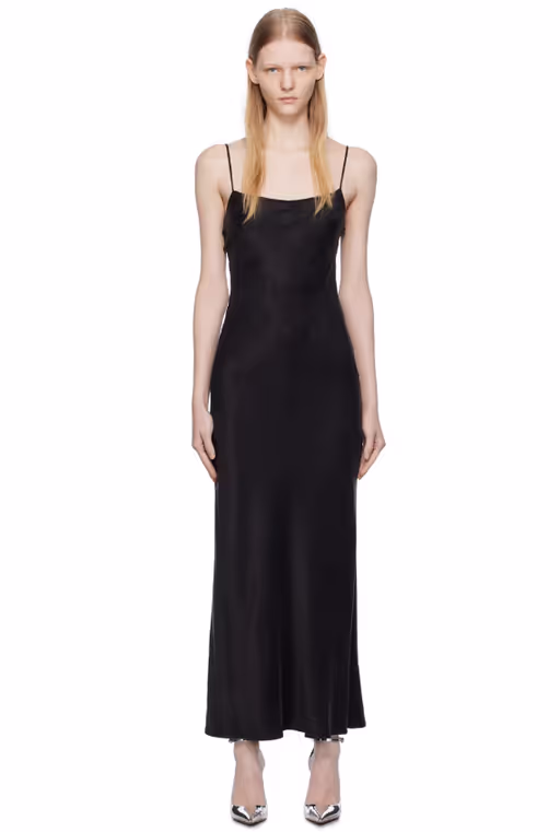 A woman wearing THIRD FORM black lip service bias maxi dress