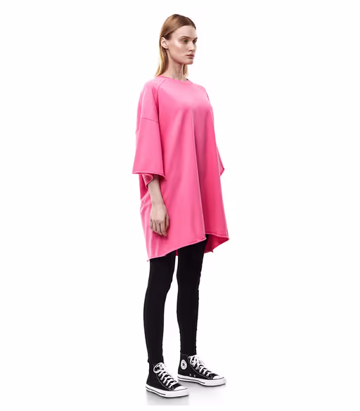 A woman wearing nununu​ women's perfect oversized hot pink t