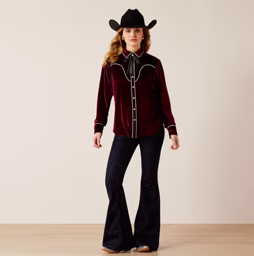 A woman wearing Ariat​ casa rosa shirt