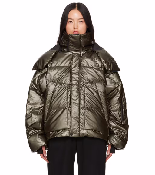 A woman wearing Templa green hyperion os down jacket